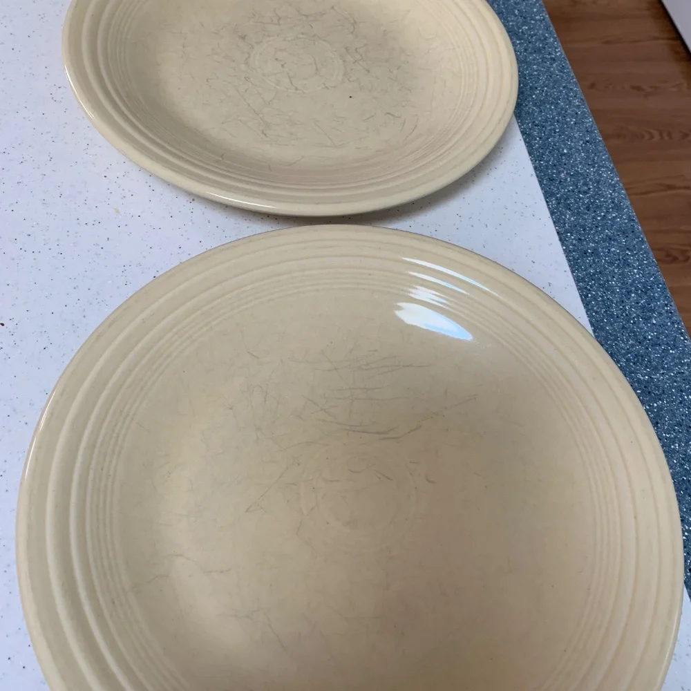 Two Fiesta Ivory Dinner Plates